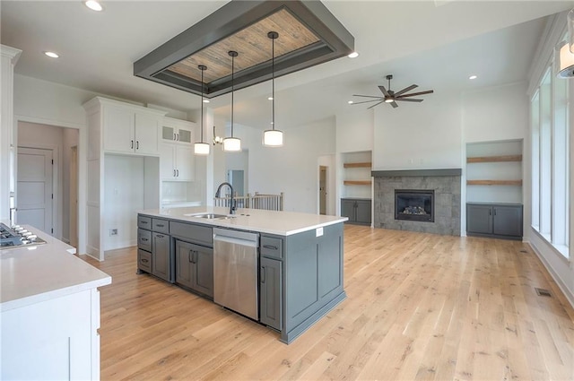 9000 N Clarion Ave, Kansas City, MO 64153 - kitchen with appliances with stainless steel finishes, ceiling fan, a tray ceiling, plenty of natural light, and recessed lighting