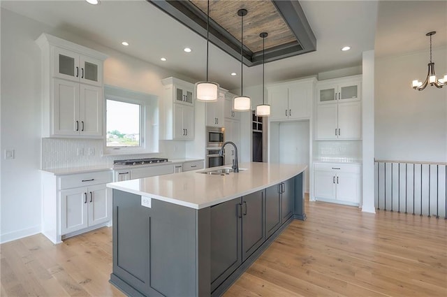 9000 N Clarion Ave, Kansas City, MO 64153 - kitchen featuring a sink, appliances with stainless steel finishes, white cabinetry, light wood-style floors, and recessed lighting