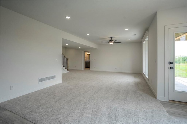 9000 N Clarion Ave, Kansas City, MO 64153 - empty room with stairs, recessed lighting, plenty of natural light, ceiling fan, and baseboards