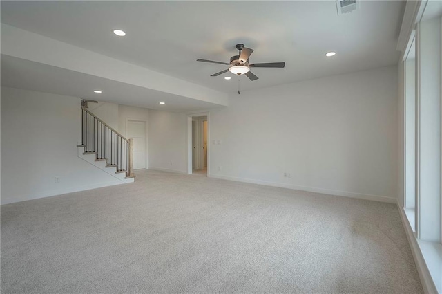 9000 N Clarion Ave, Kansas City, MO 64153 - unfurnished living room with a ceiling fan, stairway, recessed lighting, light carpet, and baseboards