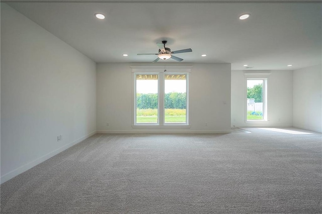 9000 N Clarion Ave, Kansas City, MO 64153 - empty room featuring recessed lighting, healthy amount of natural light, a ceiling fan, and baseboards