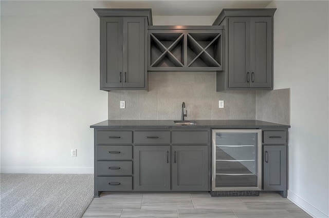 9000 N Clarion Ave, Kansas City, MO 64153 - indoor wet bar featuring beverage cooler, backsplash, and baseboards