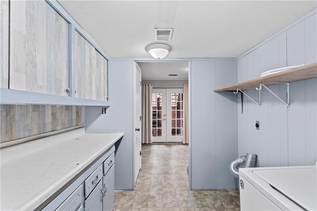 kitchen with french doors, open shelves, washer / clothes dryer, light countertops, and visible vents