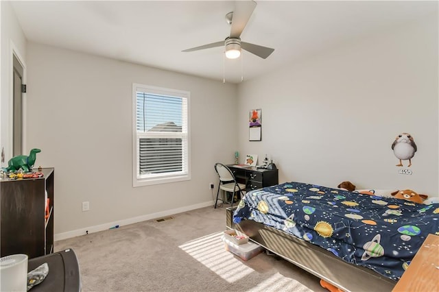 bedroom with light colored carpet and ceiling fan