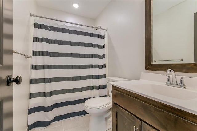 bathroom with vanity, tile patterned floors, and toilet