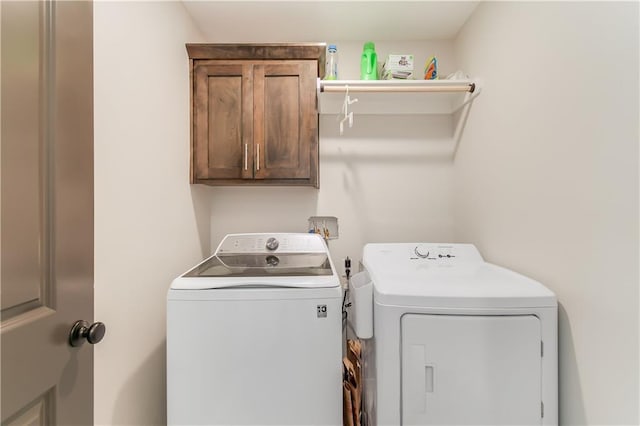 laundry area with cabinets and washer and dryer