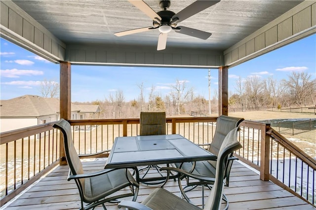 wooden terrace featuring ceiling fan