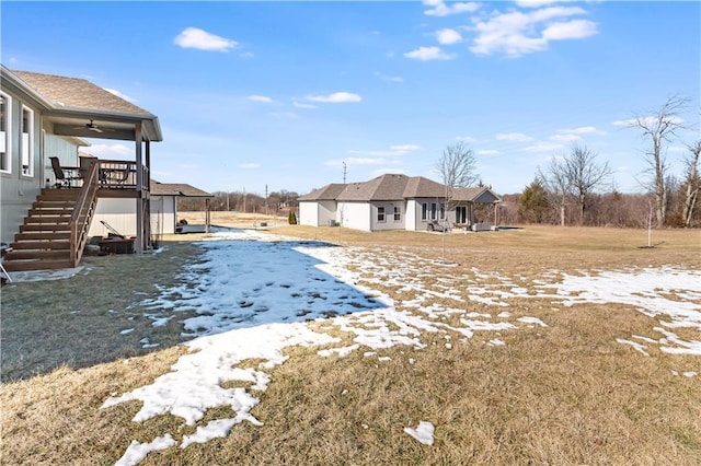 view of yard with ceiling fan