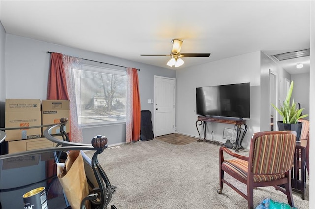 interior space featuring carpet floors and ceiling fan