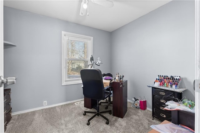 carpeted office featuring ceiling fan