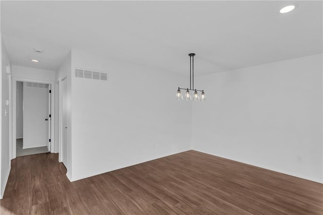 unfurnished dining area featuring dark hardwood / wood-style flooring