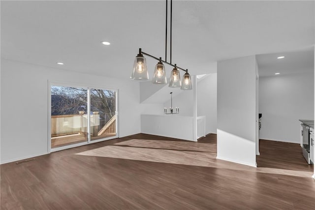 unfurnished dining area featuring dark hardwood / wood-style flooring