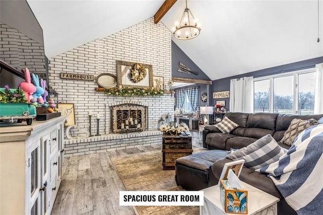 living room featuring high vaulted ceiling, a fireplace, hardwood / wood-style flooring, a notable chandelier, and beam ceiling