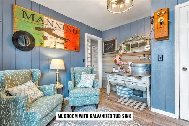 sitting room with hardwood / wood-style floors