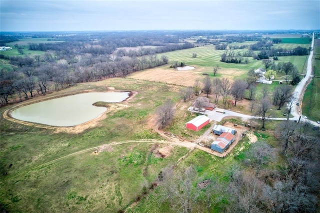 drone / aerial view featuring a water view and a rural view