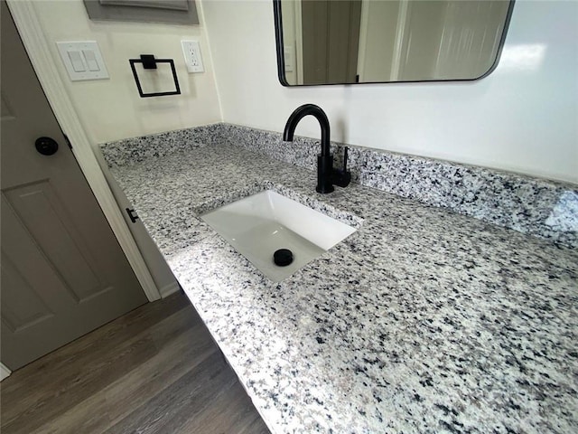 bathroom featuring vanity and hardwood / wood-style floors