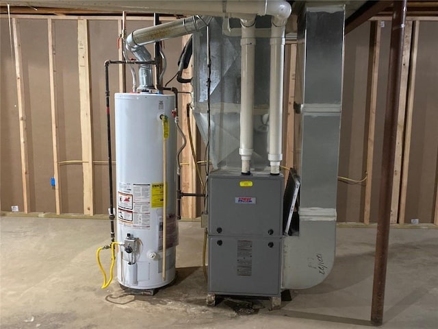 utility room featuring heating unit and water heater