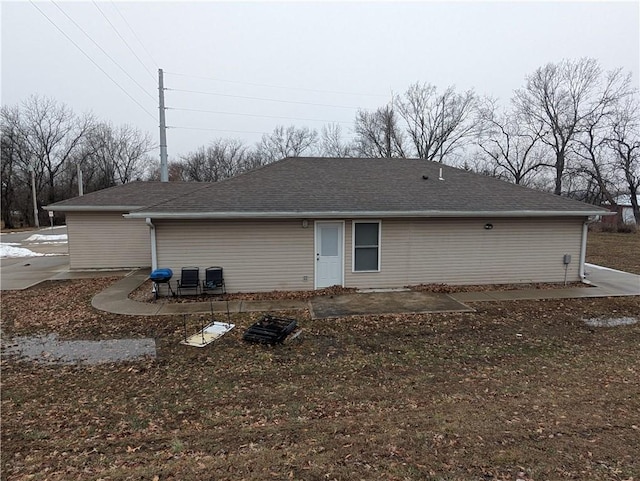 rear view of property featuring a patio