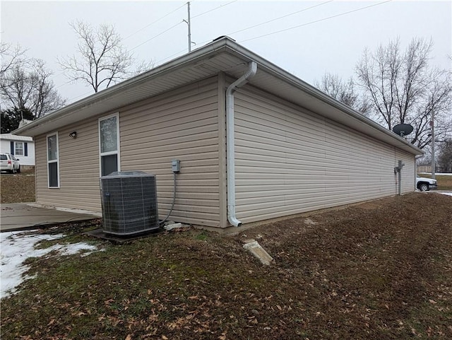 view of property exterior with central AC