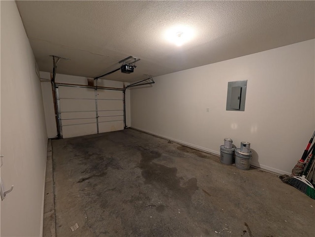 garage with a garage door opener and electric panel