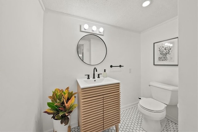 bathroom featuring vanity, tile patterned flooring, toilet, and a textured ceiling