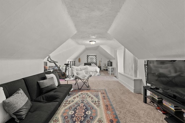 bedroom featuring light carpet, lofted ceiling, and a textured ceiling