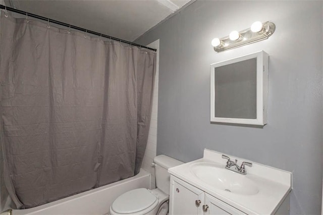 full bathroom with shower / tub combo with curtain, vanity, and toilet