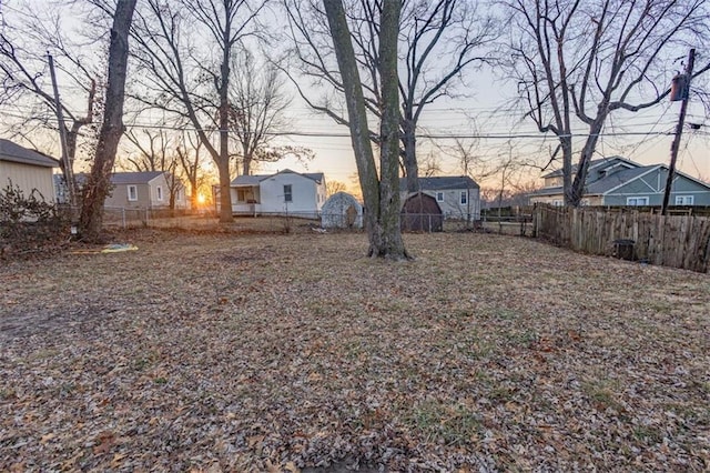 view of yard at dusk