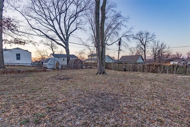 view of yard at dusk