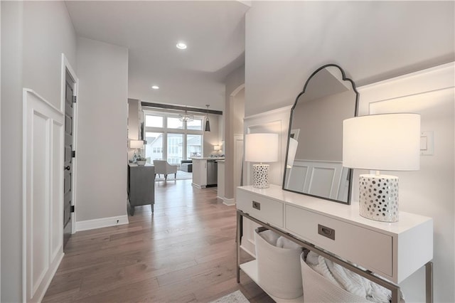 corridor with hardwood / wood-style floors