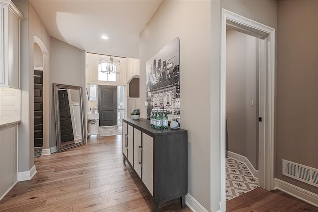 corridor featuring light hardwood / wood-style floors