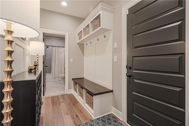 mudroom with light hardwood / wood-style floors