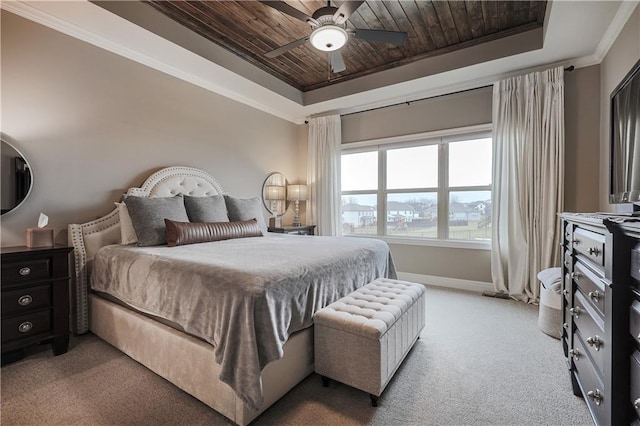 bedroom featuring ornamental molding, a tray ceiling, light carpet, and wooden ceiling