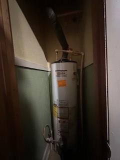 utility room with gas water heater