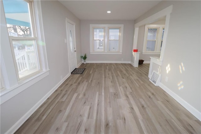 interior space featuring a healthy amount of sunlight and light hardwood / wood-style floors