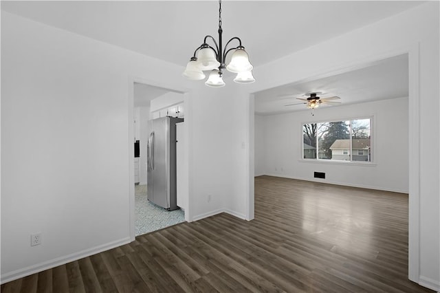 interior space with dark hardwood / wood-style flooring and ceiling fan with notable chandelier