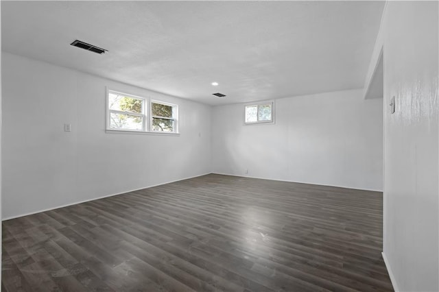 spare room featuring dark hardwood / wood-style flooring