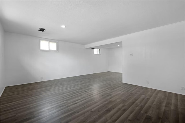 basement featuring dark wood-type flooring