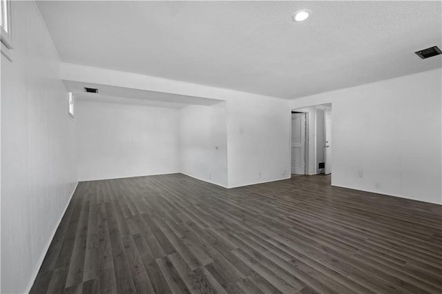 spare room with dark hardwood / wood-style flooring