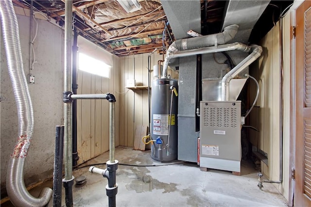 utility room featuring water heater