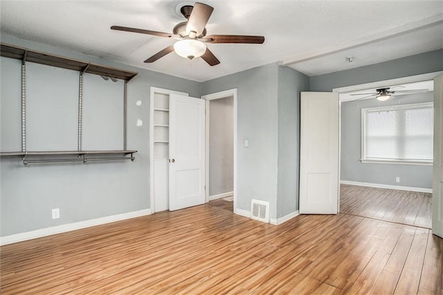 unfurnished bedroom featuring light hardwood / wood-style flooring and ceiling fan