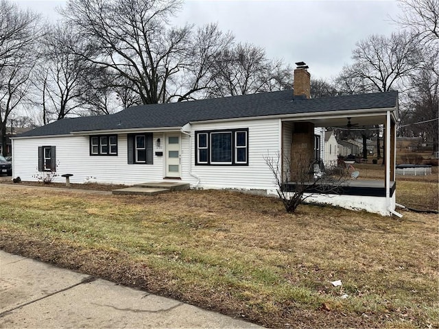 view of front of property with a front lawn