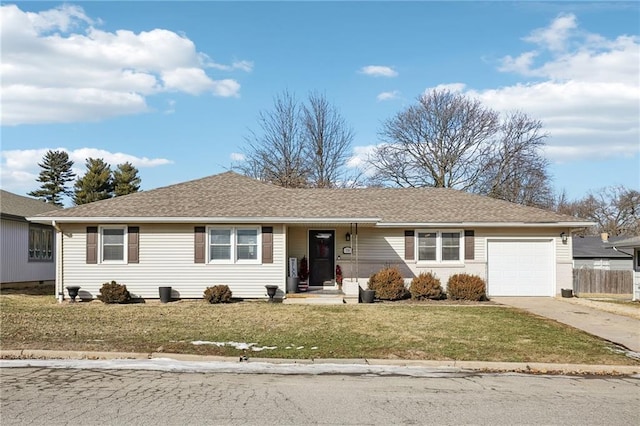 ranch-style home with a garage and a front yard