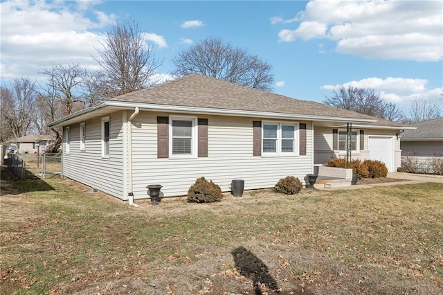 view of home's exterior with a yard and a garage