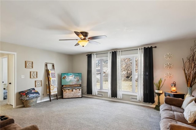 living room featuring ceiling fan and carpet flooring