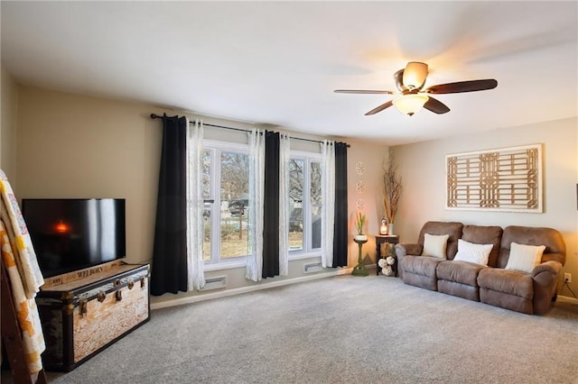 carpeted living room featuring ceiling fan