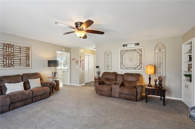 carpeted living room featuring ceiling fan