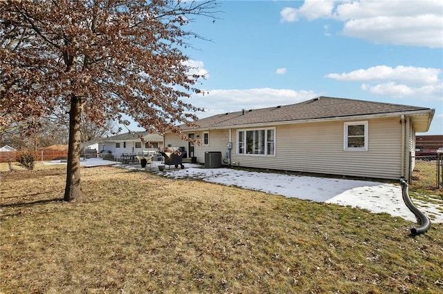 rear view of property featuring central AC, a yard, and a patio