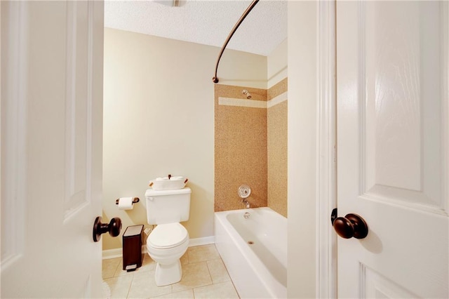 bathroom featuring tiled shower / bath, tile patterned floors, toilet, and a textured ceiling