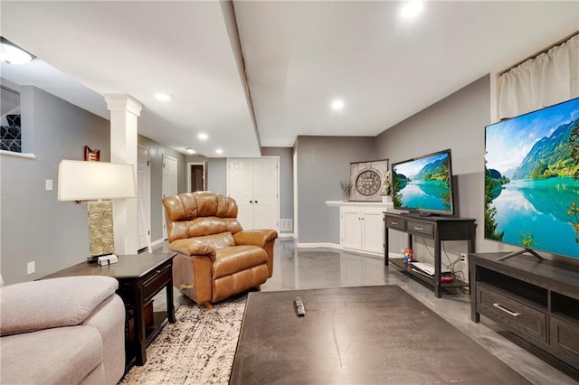 living room featuring decorative columns